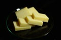 Hard cheese sliced Ã¢â¬â¹Ã¢â¬â¹on a black background